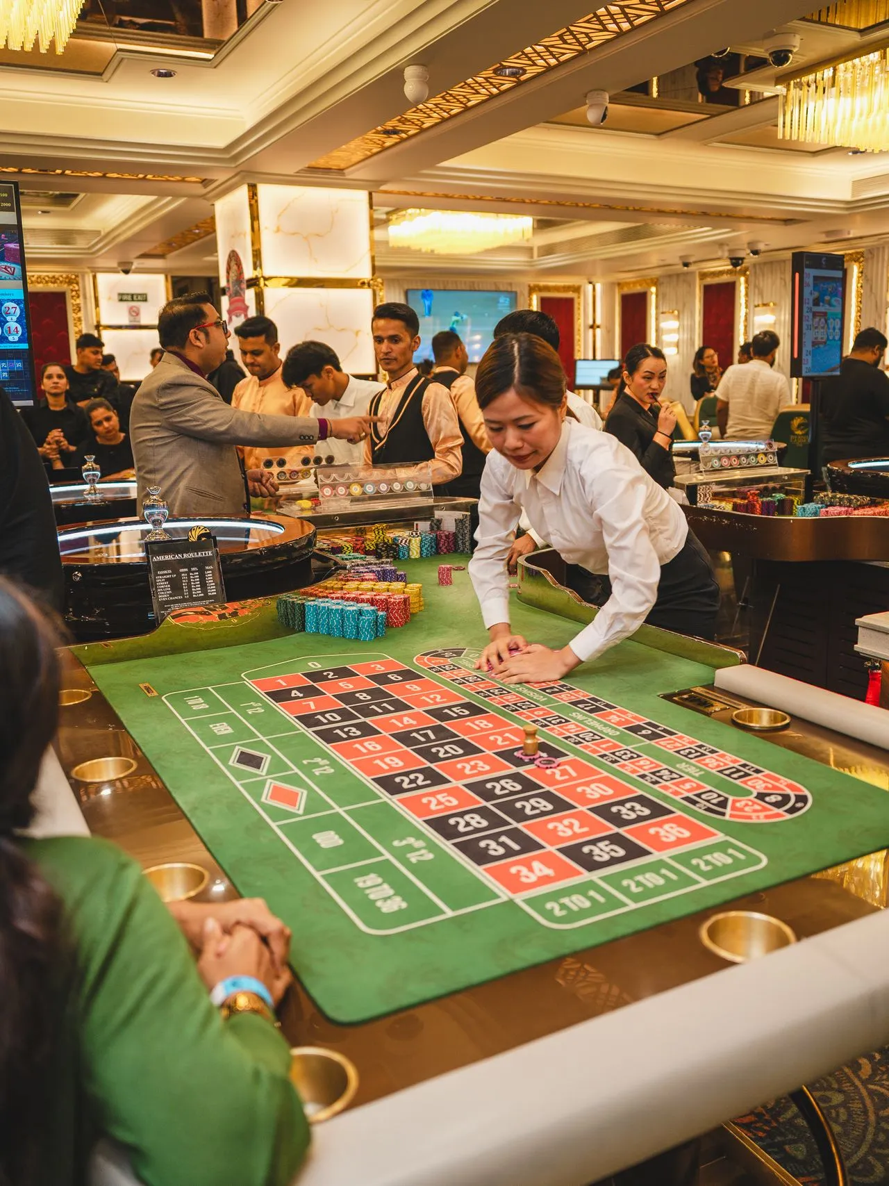 Guests gathered around a roulette table